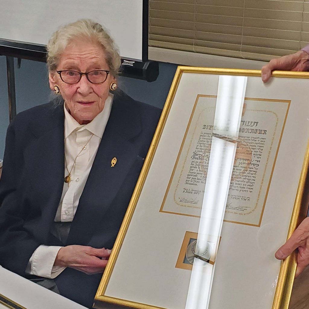 Mrs. Anne-Marie Johnston and her family's Yad Vashem medal