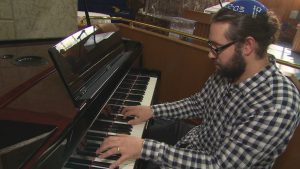 Rabbi Matthew Leibl playing piano